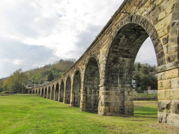The Great Stone Viaduct on the bright green grass
