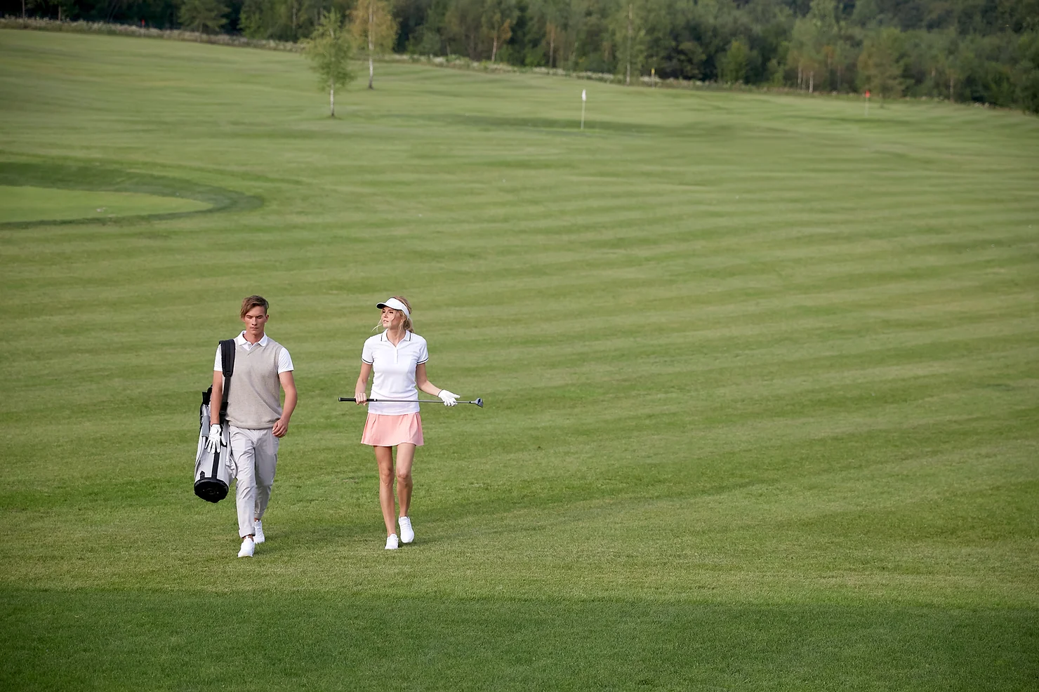 Two golfers enjoying a day at the golf course